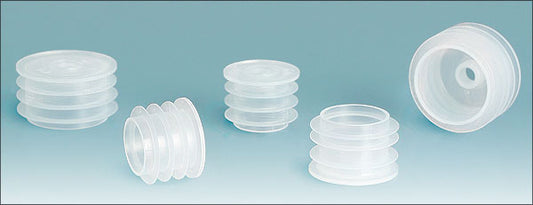 An assortment of clear plastic bottle dropper plugs in various sizes displayed against a light blue background.